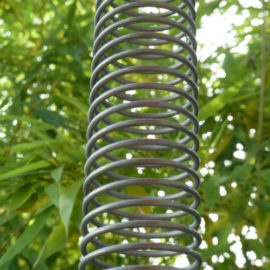 Ornemental stainless steel downspout shaped like a spring